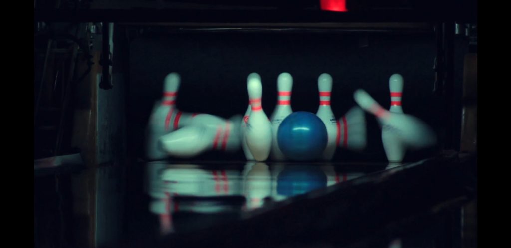 Photo of pins splashing bowling lingo